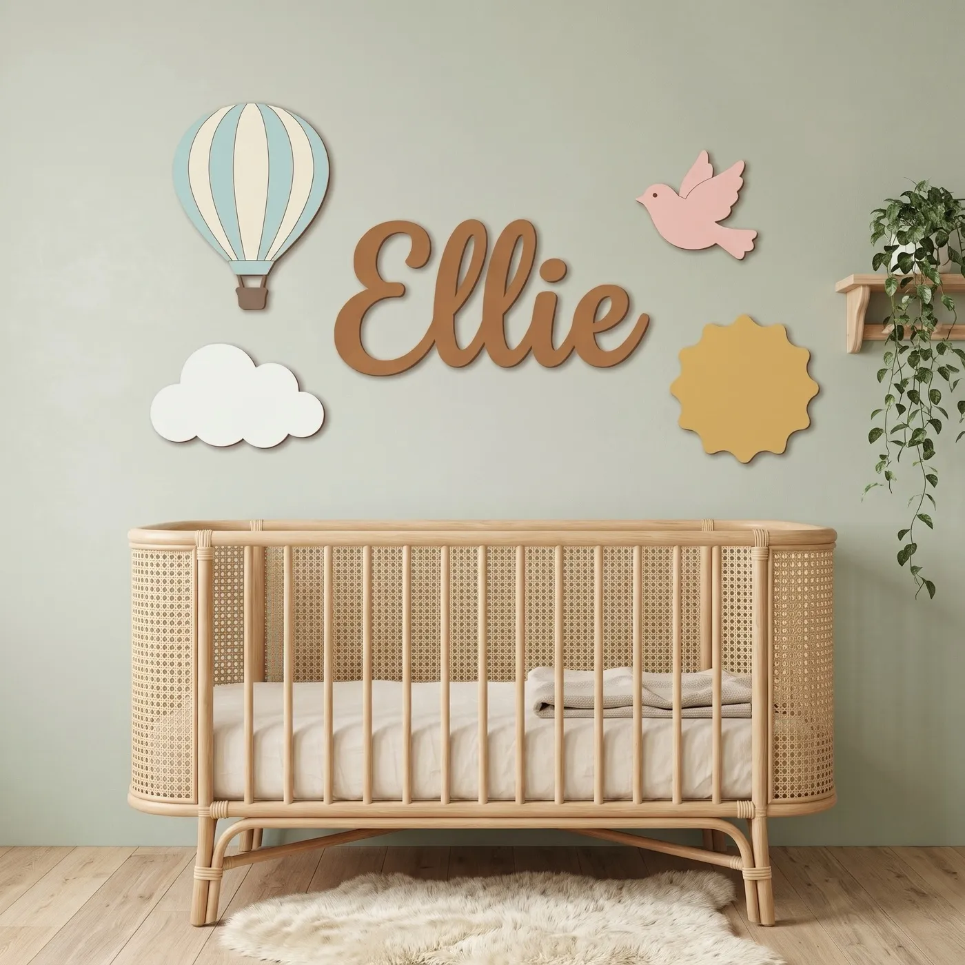 Hot Air Balloon name sign with the name Ellie above a crib