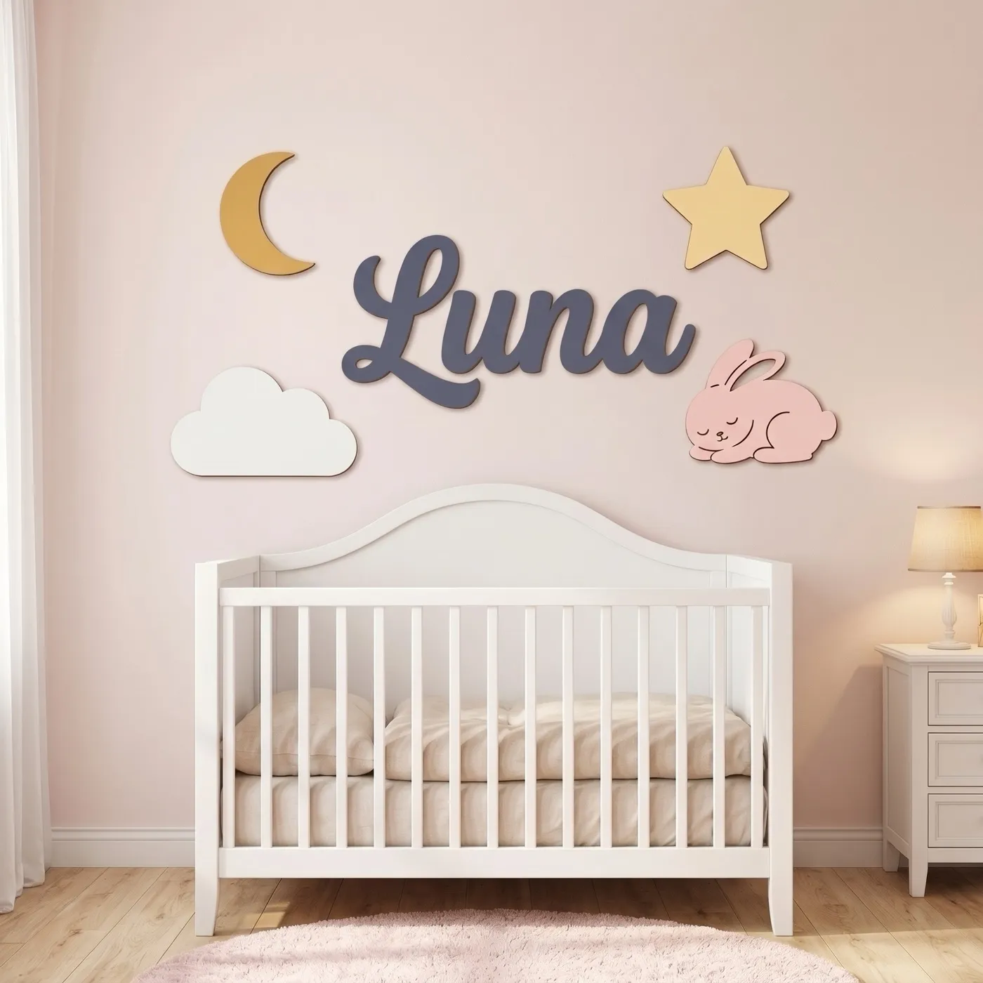 Moon & Stars name sign with the name Luna above a crib
