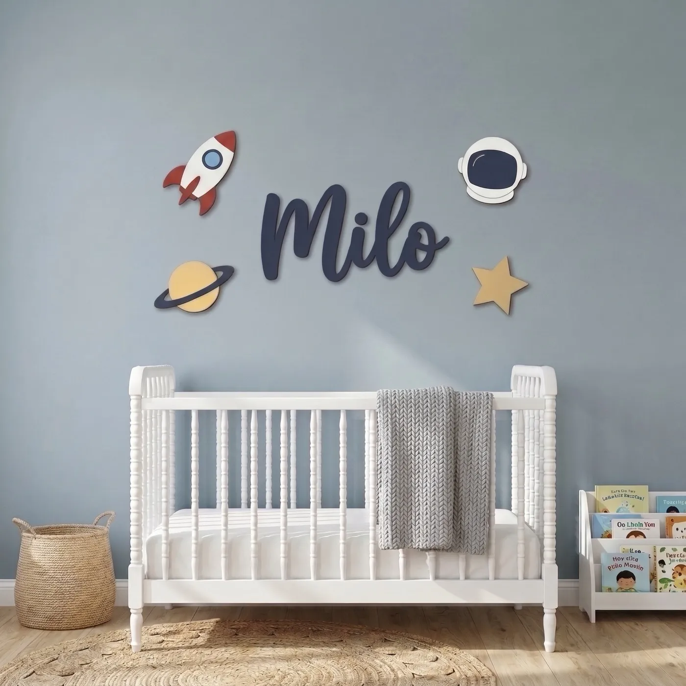 Space name sign with the name Milo above a crib